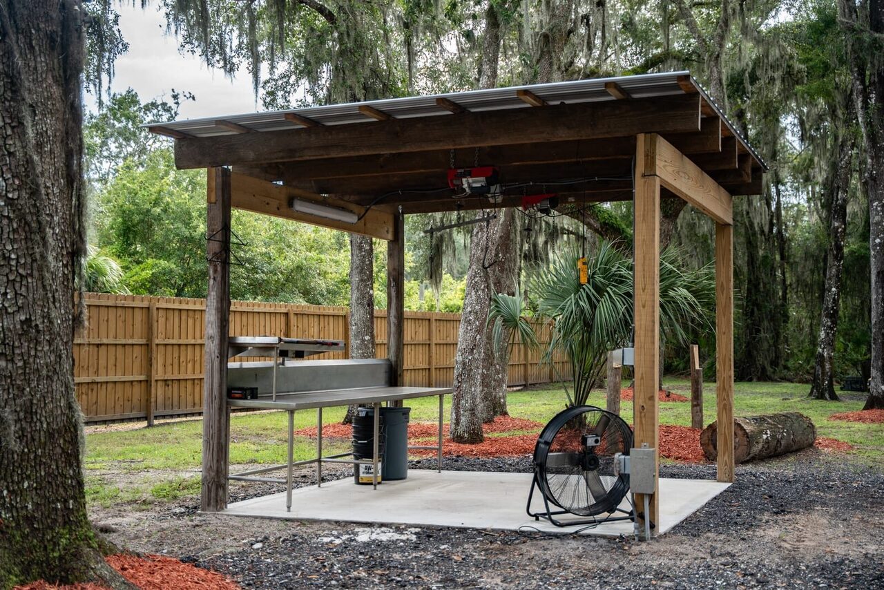 Covered game-cleaning station for processing wild hogs at Brawler Creek Ranch